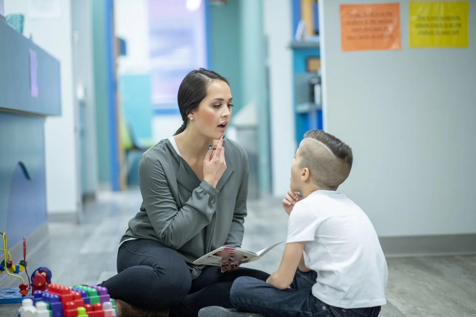 Speech therapist working with a child.